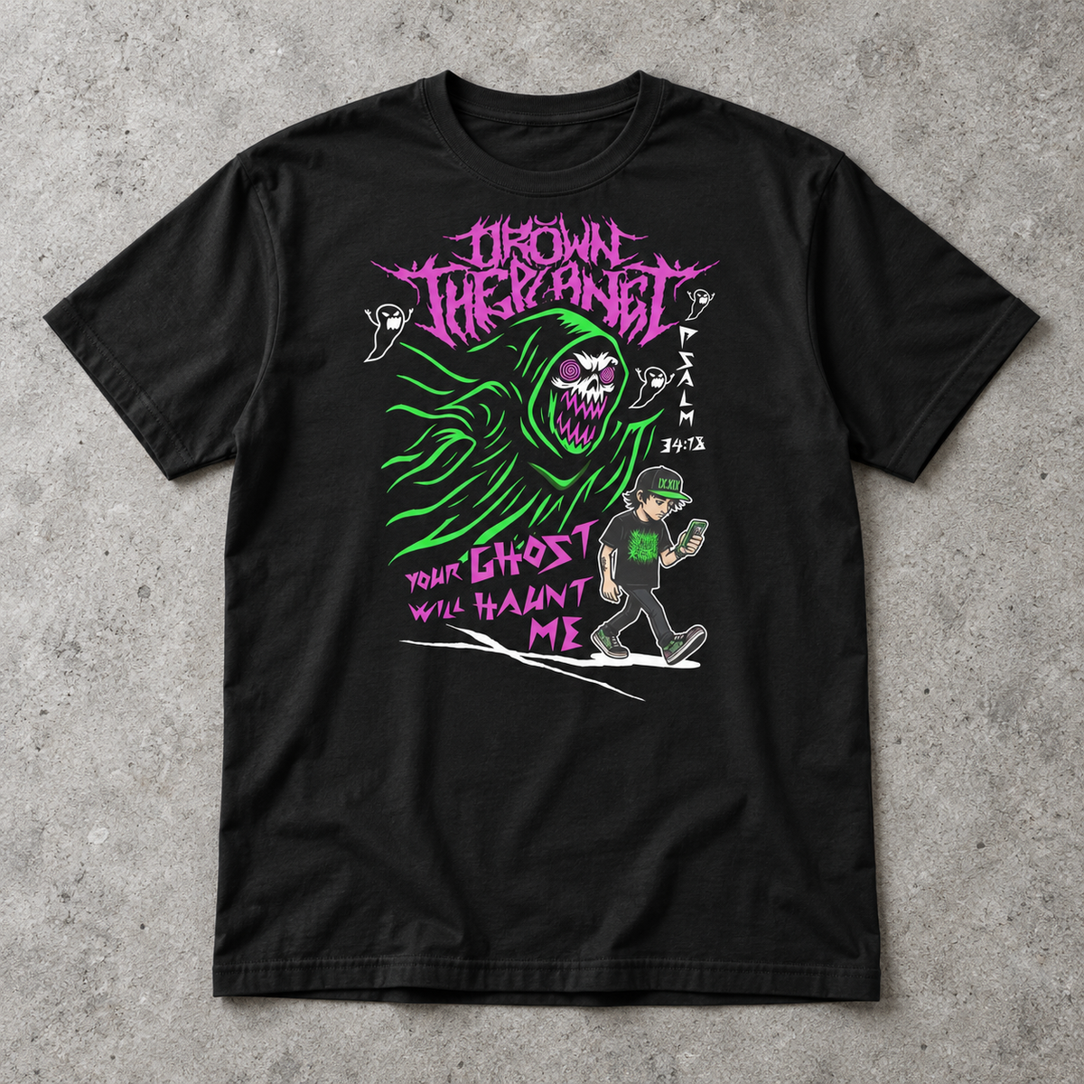 A black short-sleeve graphic t-shirt laid flat on a textured gray concrete background. The graphic features a green ghostly figure, a cartoon character in a green cap, and pink text reading 'DROWN IN THE PLANET' and 'YOUR GHOST WILL HAUNT ME'.